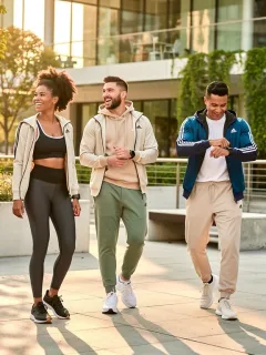 Stylish individuals demonstrating the evolution of athleisure wear in an urban environment, highlighting comfort and modern design.