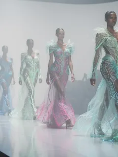 Models showcasing innovative futuristic fabrics on a runway